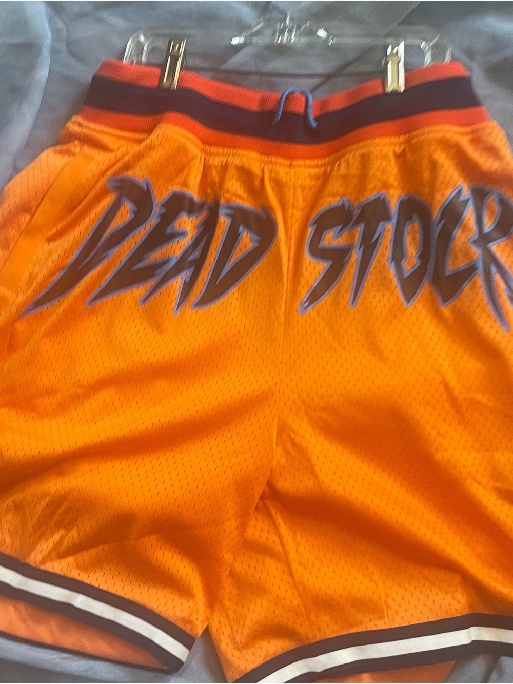 "DEAD STOCK."vibrant orange mesh basketball shorts